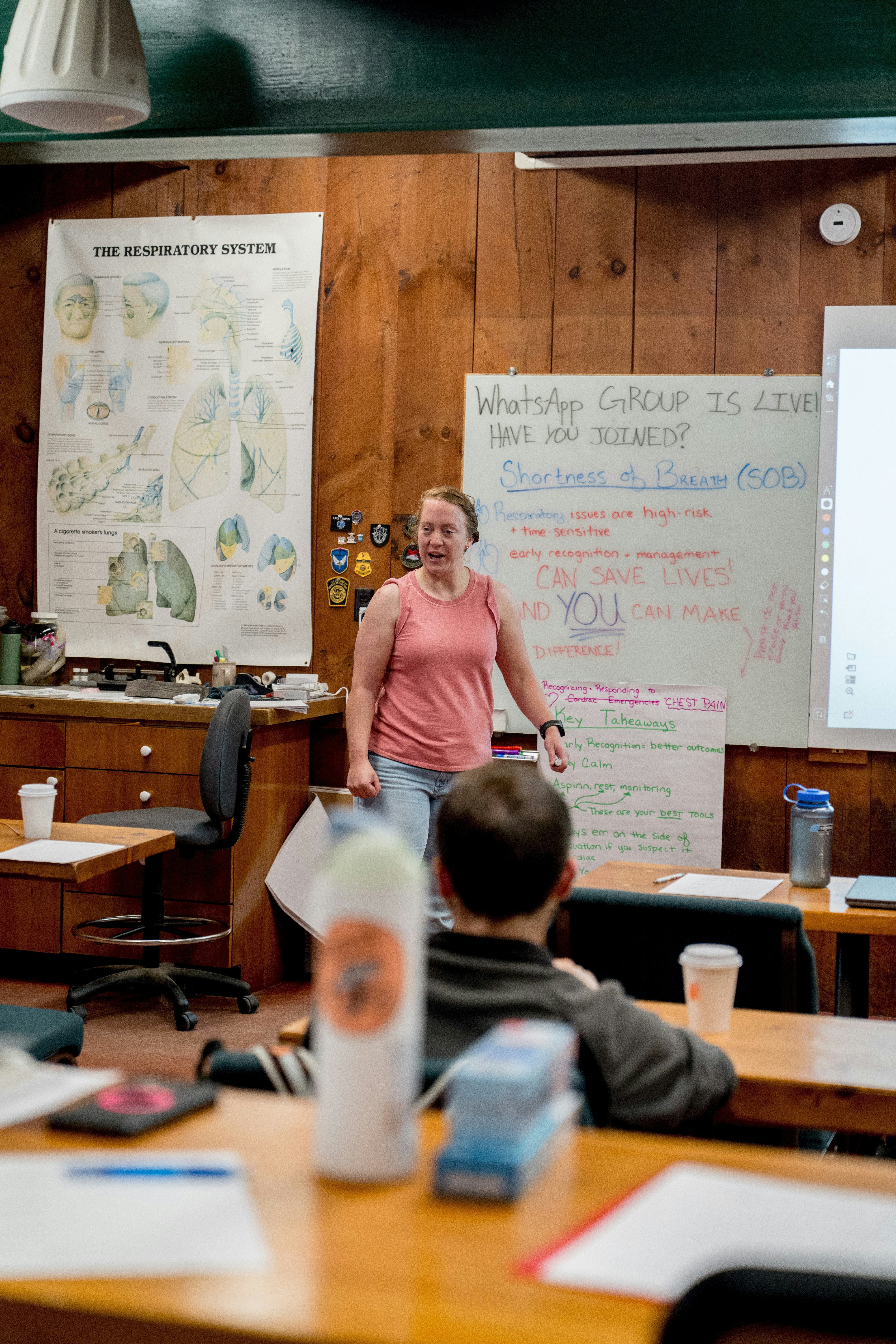 Educator in a classroom with instructional materials